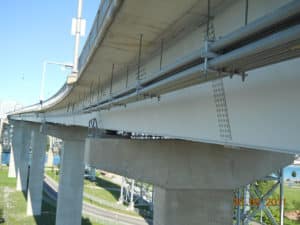 Photo of fiberglass conduit under a bridge
