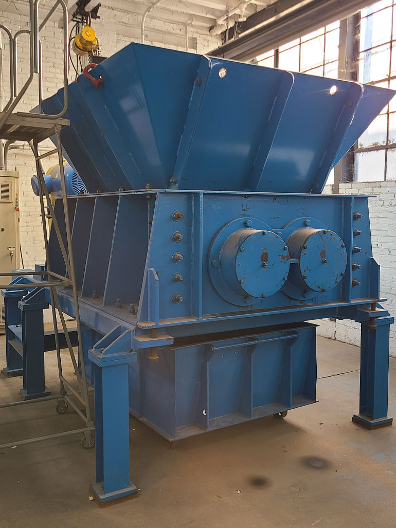 A Hammer mill grinding machine for fiberglass reinforced epoxy conduit disposal