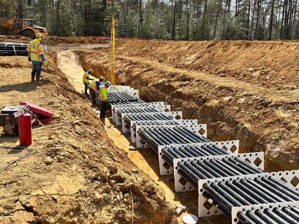 A fiberglass conduit duct bank in a trench.